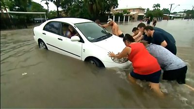 Intense rain in north-eastern Australia triggers severe flooding, turning streets into rivers.