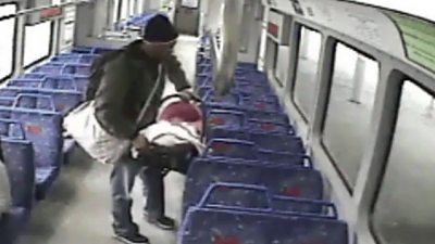 Man with baby on train