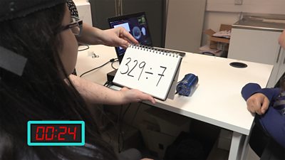 Girl completing maths problem as part of an experiment