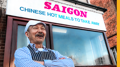 Sam smiling in front of his takeaway