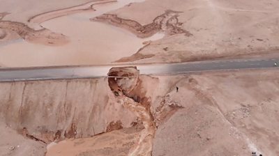 Road in desert washed away