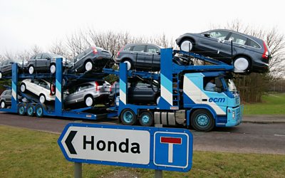 A transporter loaded with Honda cars leaves the Swindon factory on January 30, 2009.