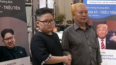 People with their hair styled as Kim Jong-un and Donald Trump in Hanoi, Vietnam