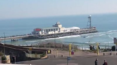 Watercraft and surfers at Bournemouth Pier