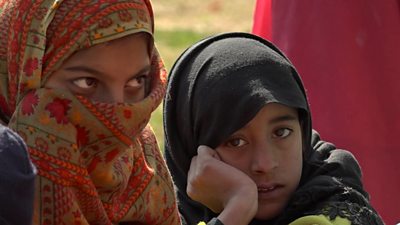 A child looks tiredly at a camera in Pakistan-occupied Kashmir