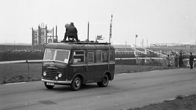 鶹Լ Outside Broadcast 'roving eye' vehicle getting ready to shoot the 1960 Grand National. The cameraman and camera are fixed to the roof of the van. 