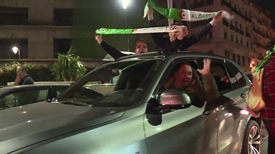 People celebrate in car in Algiers