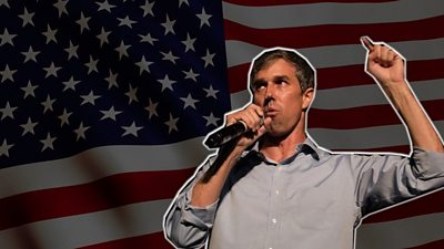 Beto O'Rourke in front of US flag
