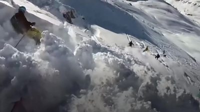 Skiers in an avalanche