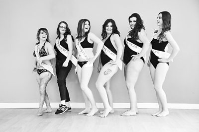 A line of pageant contestants posing
