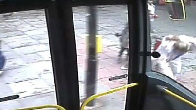 Woman 'pushed' in front of London bus