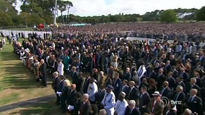 Crowds gather at the memorial service