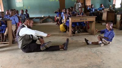 Sackey Percy dancing in his classroom