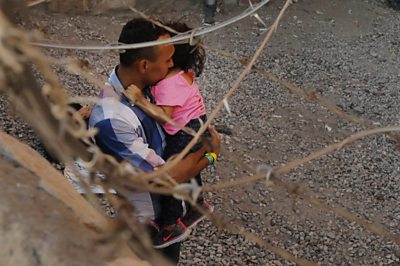 A man and child in an enclosure, El Paso