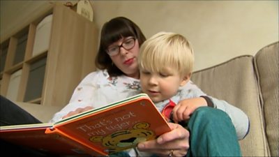 Mother reading to toddler