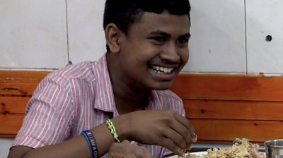 Sri Lankan boy eating kottu roti