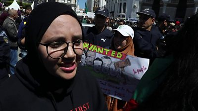 A young woman speaks during a protest