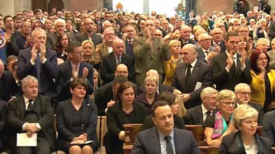 The congregation applauds priest's words