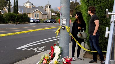 Flowers near the scene of the shooting.