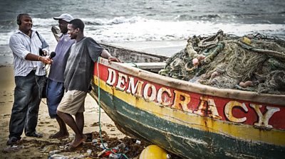 BBC Journalist, Hassan Arouni, interviewing members of the community in Sierra Leone
