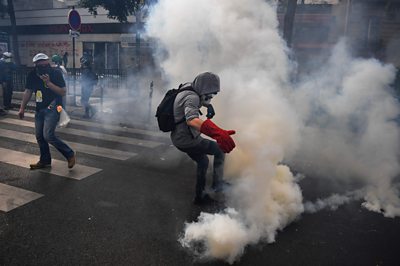 Man amid tear gas in Paris