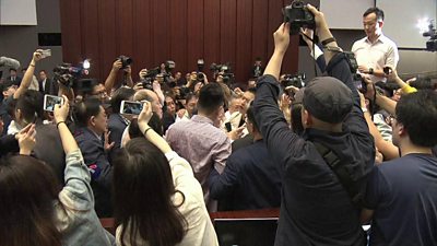 Lawmakers fight in Hong Kong over proposed changes to the territory's extradition law