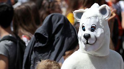 A protester dressed in a polar bear costume is seen in Brussels