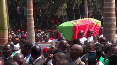 Jonas Savimbi's coffin is carried to its final resting place