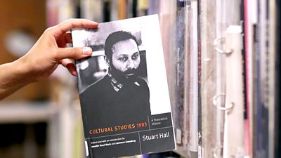 Hand holding a copy of 'Cultural Studies' by Stuart Hall