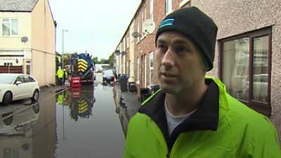 Man in flooded street