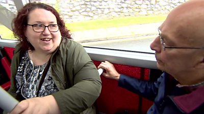 Passengers chatting on a bus in Plymouth