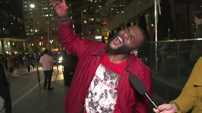 A fan exclaims to the sky while being interviewed on Toronto's streets