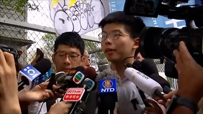 Joshua Wong talks to press