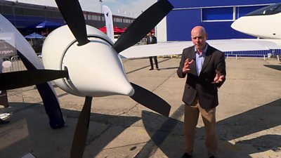 Theo Leggett next to an electric propellor