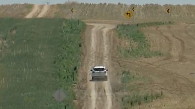 Car on unpaved road