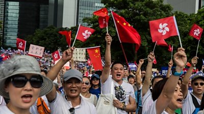 Demonstrators rally in support of police outside the Legislative Council in Hong Kong