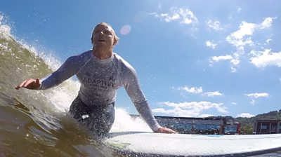 Adaptive surfer Llywelyn Williams in action at Adventure Parc Snowdonia