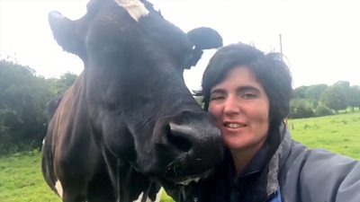 Abi Reader with one of her cows