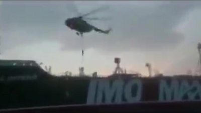 A helicopter hovering above what appears to be the Stena Impero