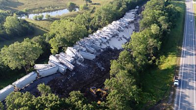 Drone footage shows the Florida-bound train with dozens of cars hanging off the rails in Missouri.