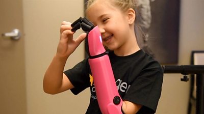 Eight-year-old Mady, the youngest recipient of a bionic arm in the US, requested it be bright pink.