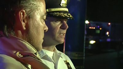 Assistant Police Chief Matt Carper talks to reporters after the Dayton shooting