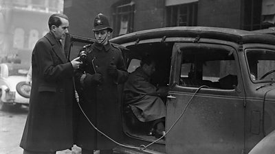 Ed Murrow interviews a policeman during the London blitz.