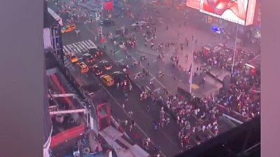 Crowds flee New York tourist attraction after motorbike backfiring is mistaken for an active shooter.