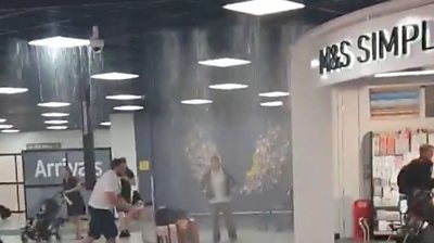An airport apologises after rainfall led to water pouring from the roof of the building.