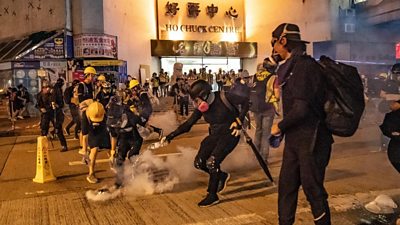 Police fired tear gas across downtown Hong Kong on Sunday night