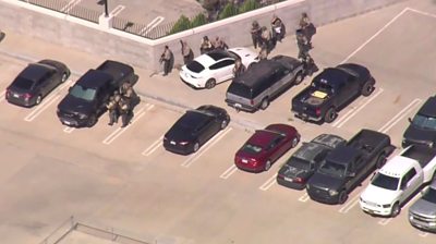 Aerial shot of police officers in car park