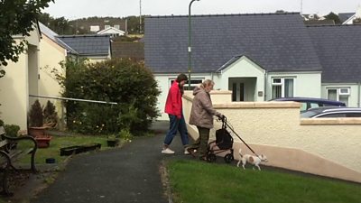 Kelly Dixon and Gaynor Lynch take pet dog Pudding for a walk
