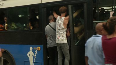 Cubans travel in a crowded bus in Havana