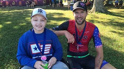Owen sprinted across the finish line at the race in Muncie, Indiana with the help of a local athlete.